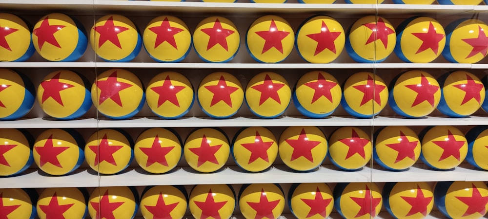 a row of yellow and red stars on a shelf
