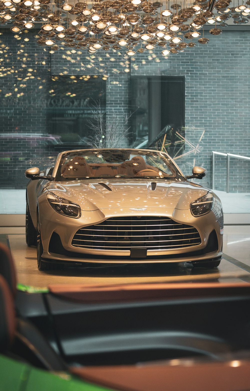 a luxury car is parked in a showroom