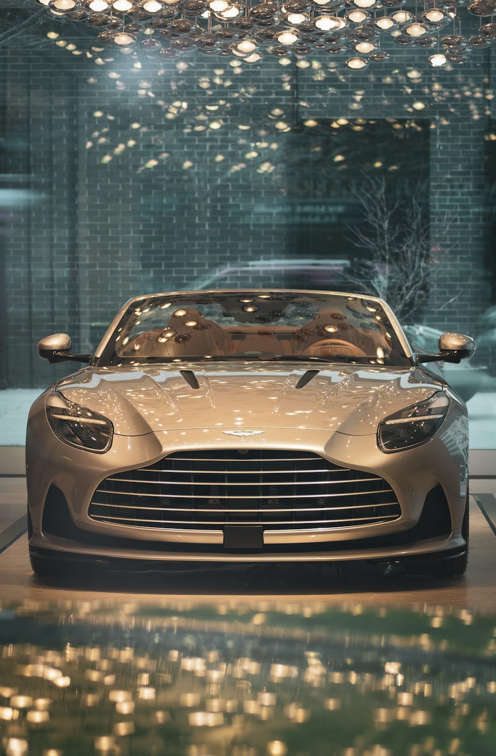 a silver sports car parked in front of a building