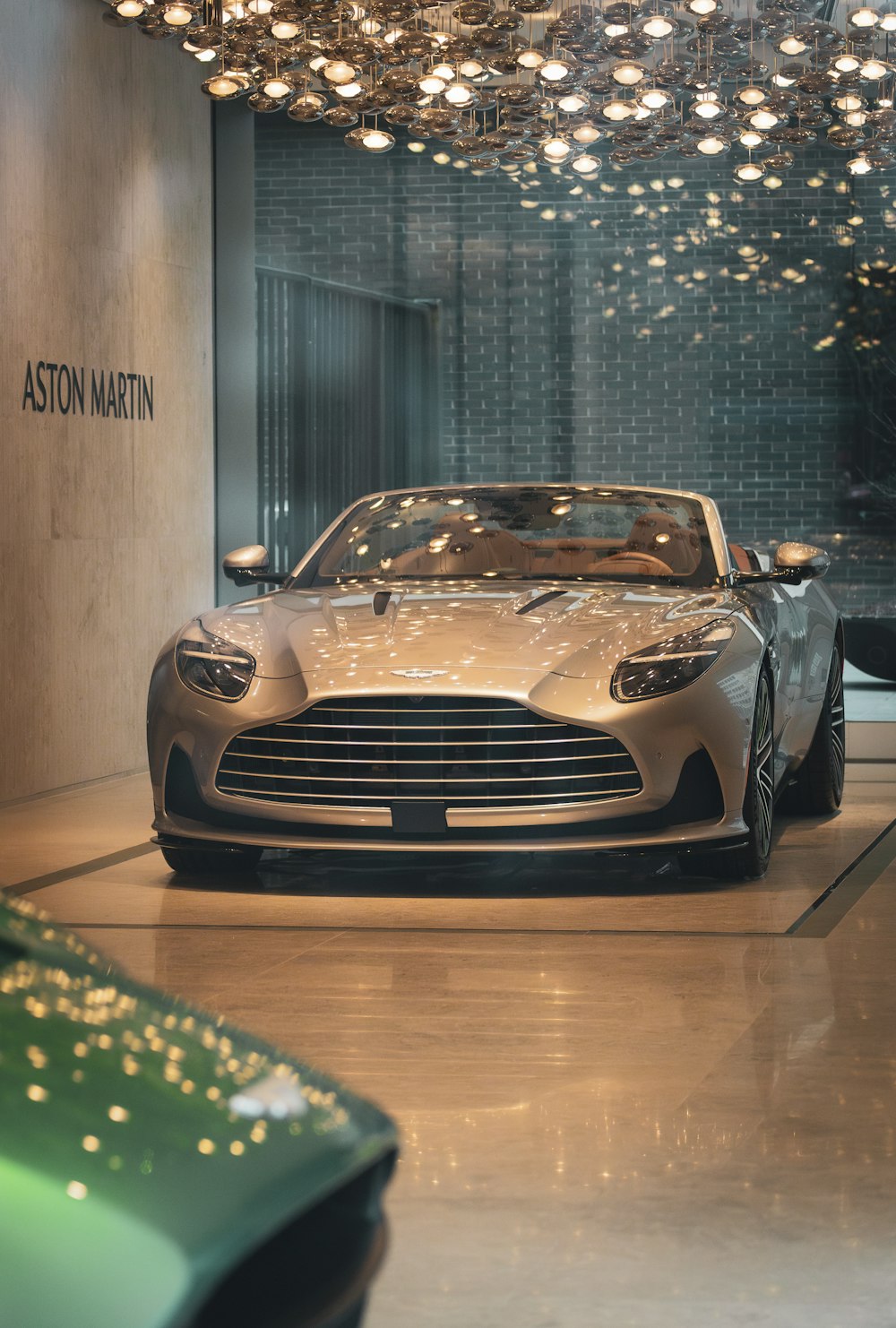 a silver car is parked in a showroom