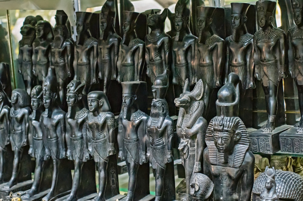 a bunch of statues that are sitting on a table