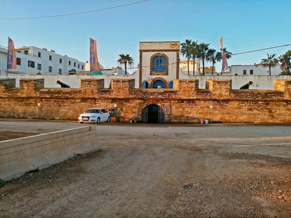 a car is parked in front of a building