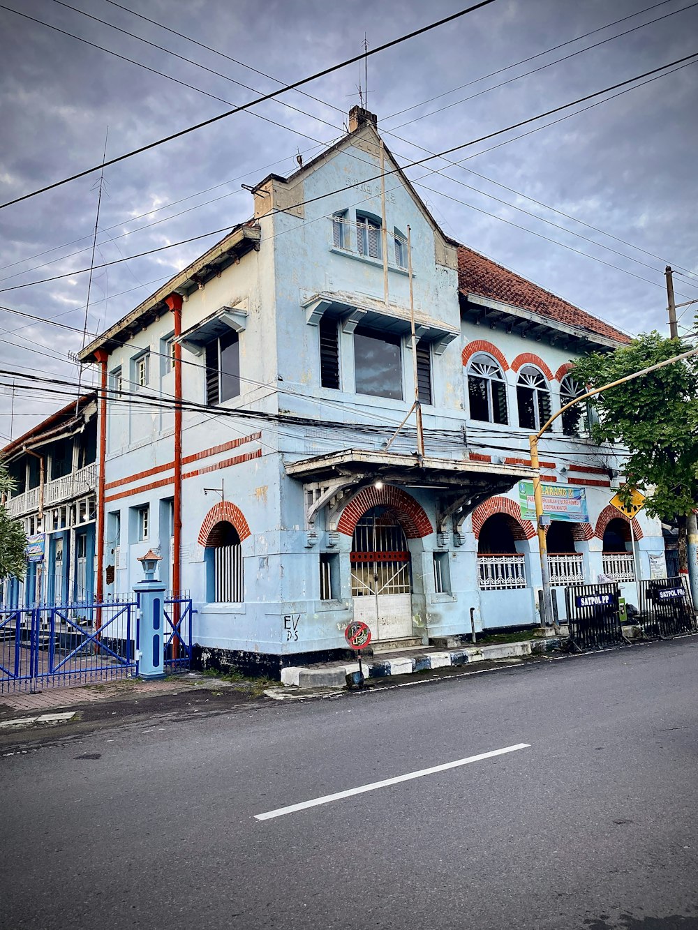 a large blue building sitting on the side of a road