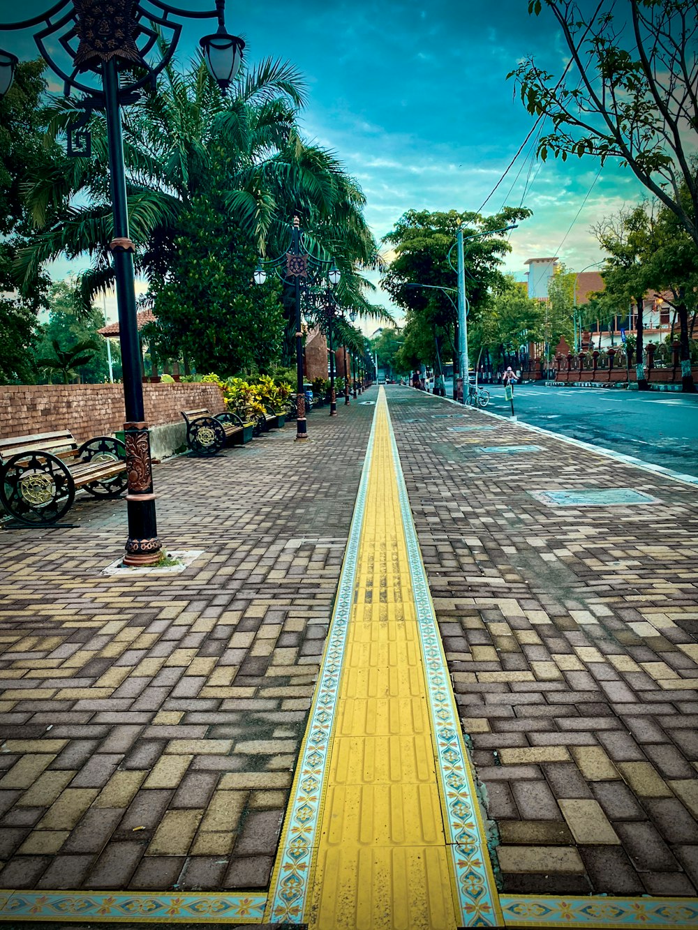 a street with a yellow line painted on the side of it
