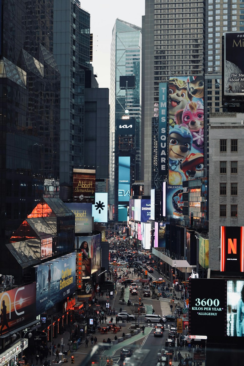 a city street filled with lots of tall buildings