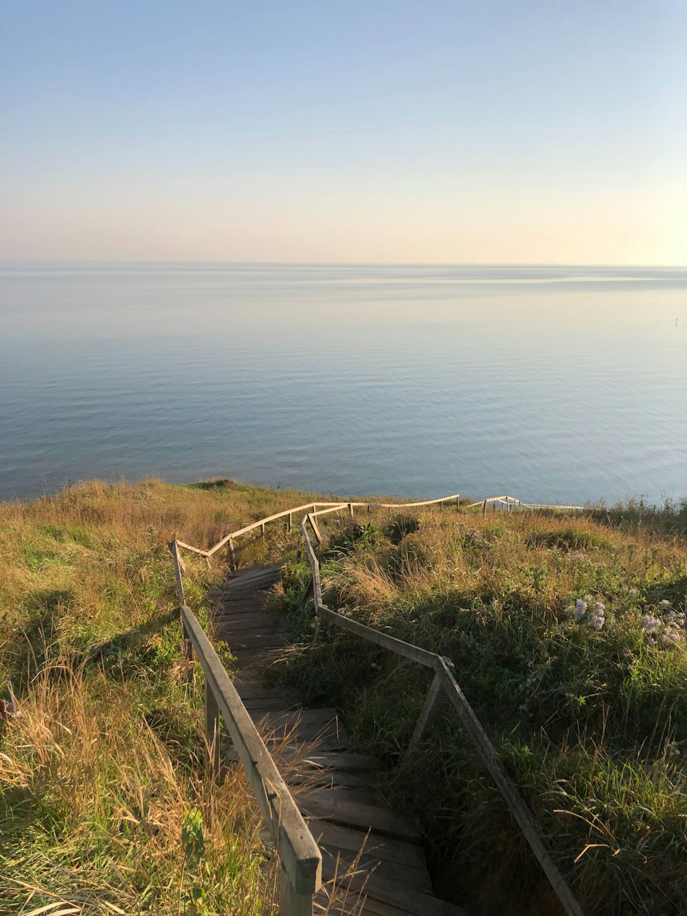 a set of stairs leading down to the ocean