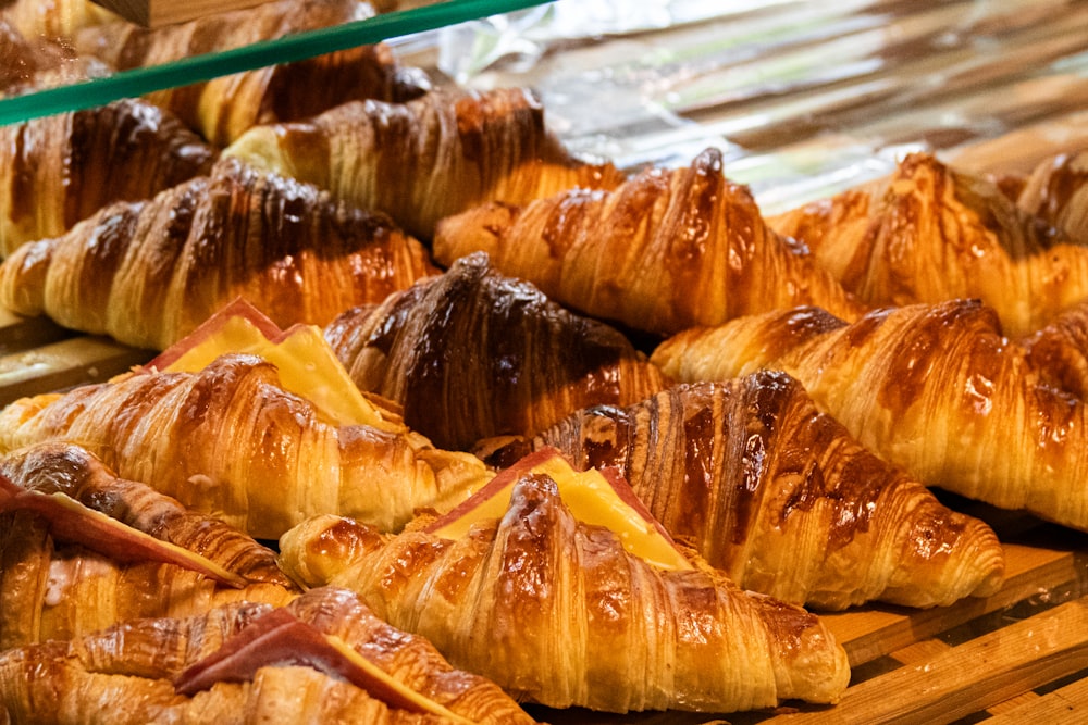 a bunch of croissants that are sitting on a table