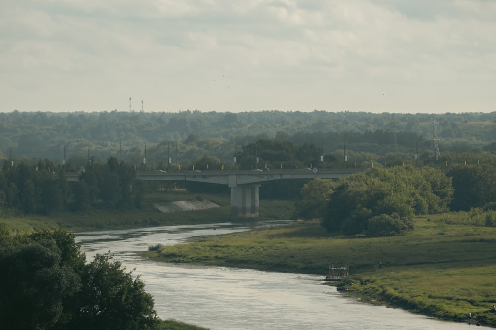 a river running through a lush green countryside