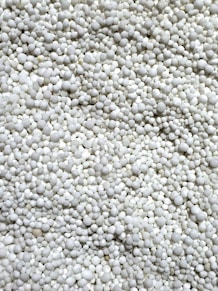 a close up of a bunch of white balls