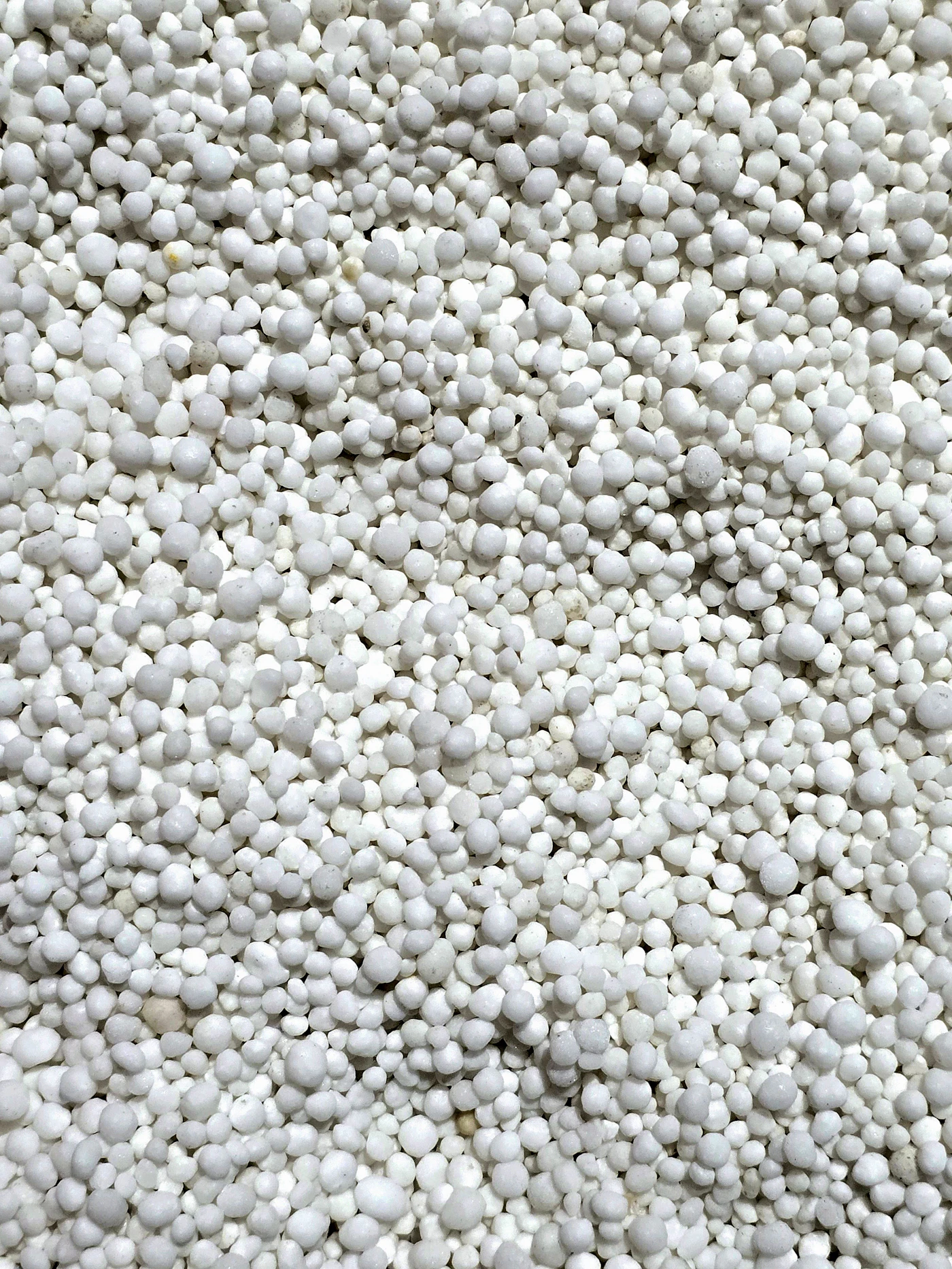 Close-up of white fertilizer granules