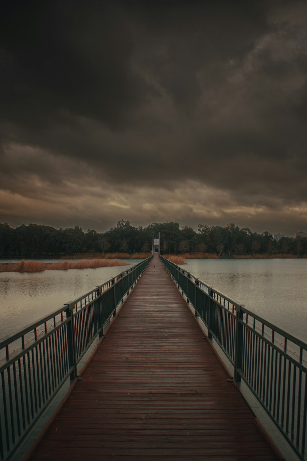 a long wooden bridge over a body of water