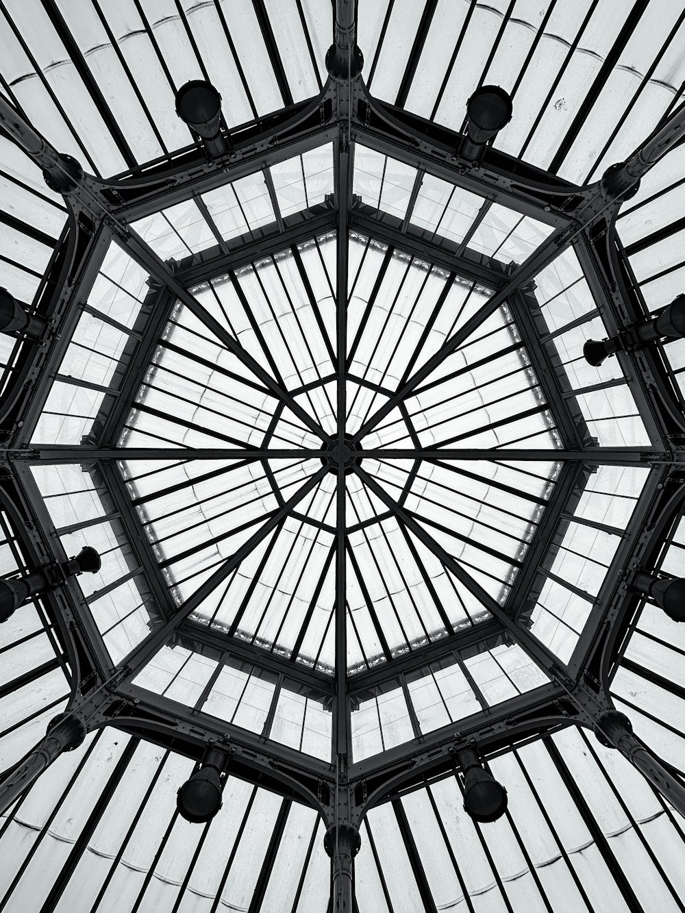 the ceiling of a building with a glass roof