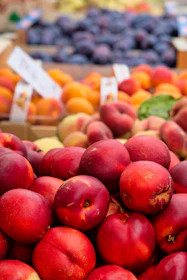 a pile of fruit sitting on top of a table
