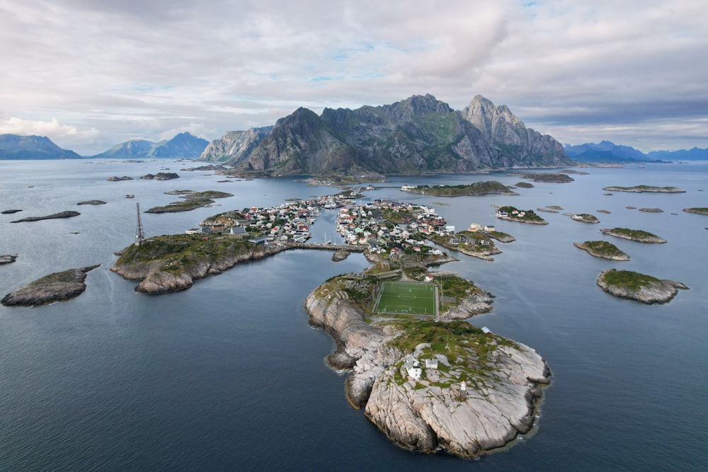 an aerial view of a small village on an island in the middle of the ocean