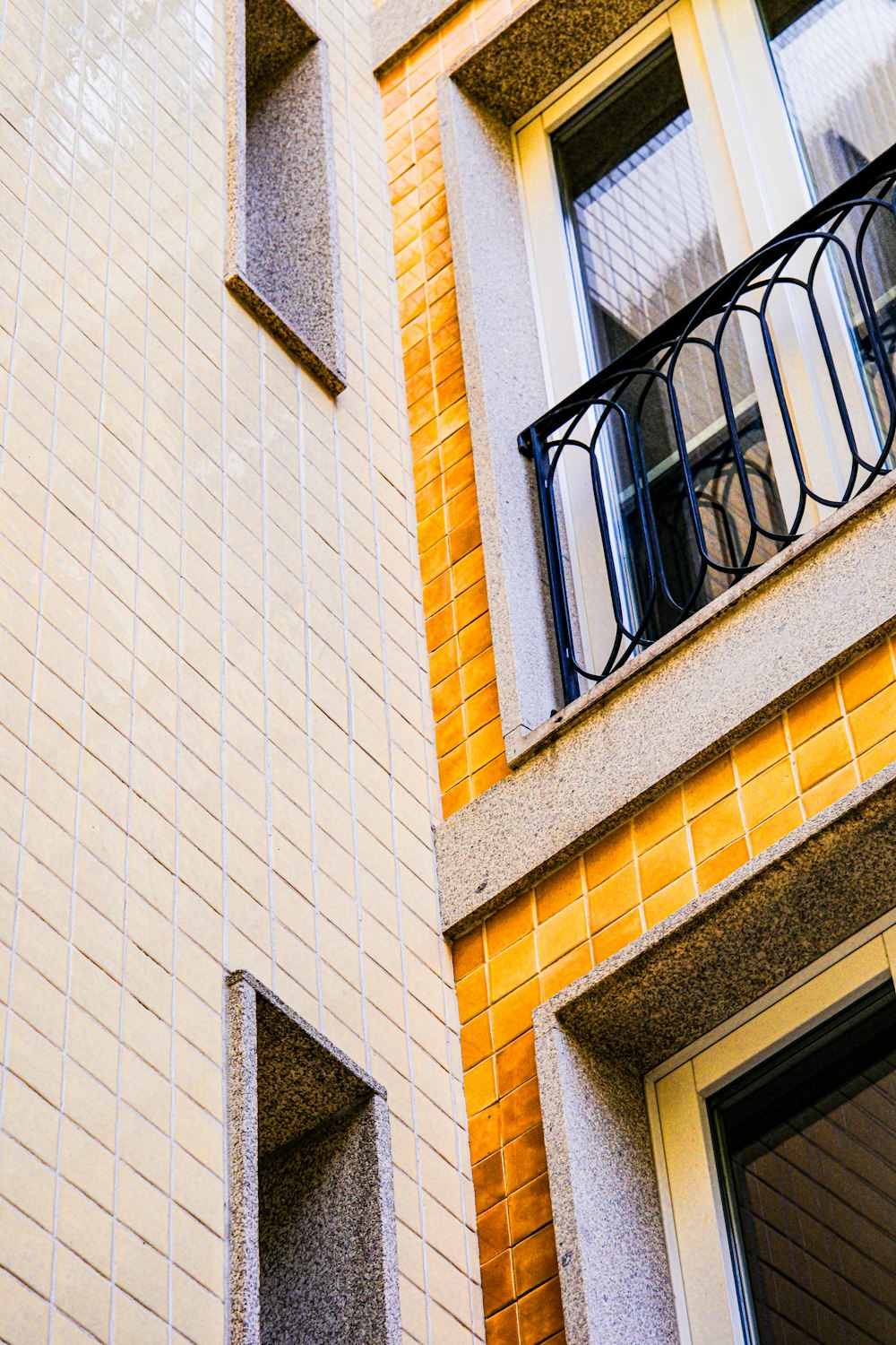 a building with a balcony and a clock on it