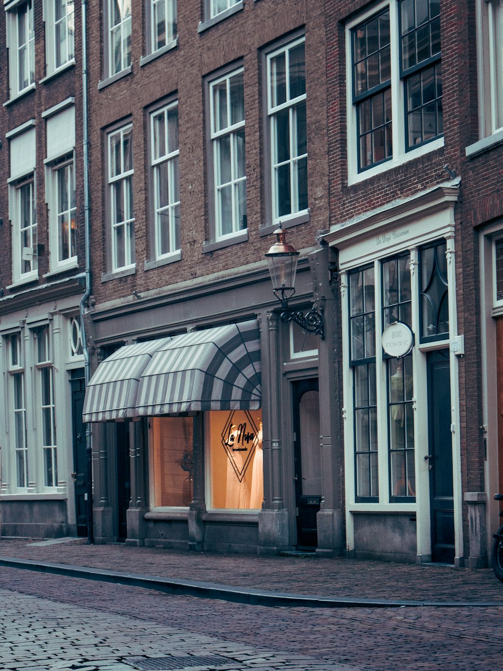 a storefront with a clock on the front of it