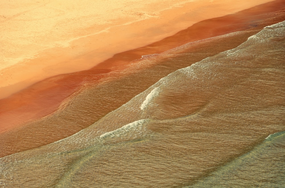 a bird's eye view of a sandy beach