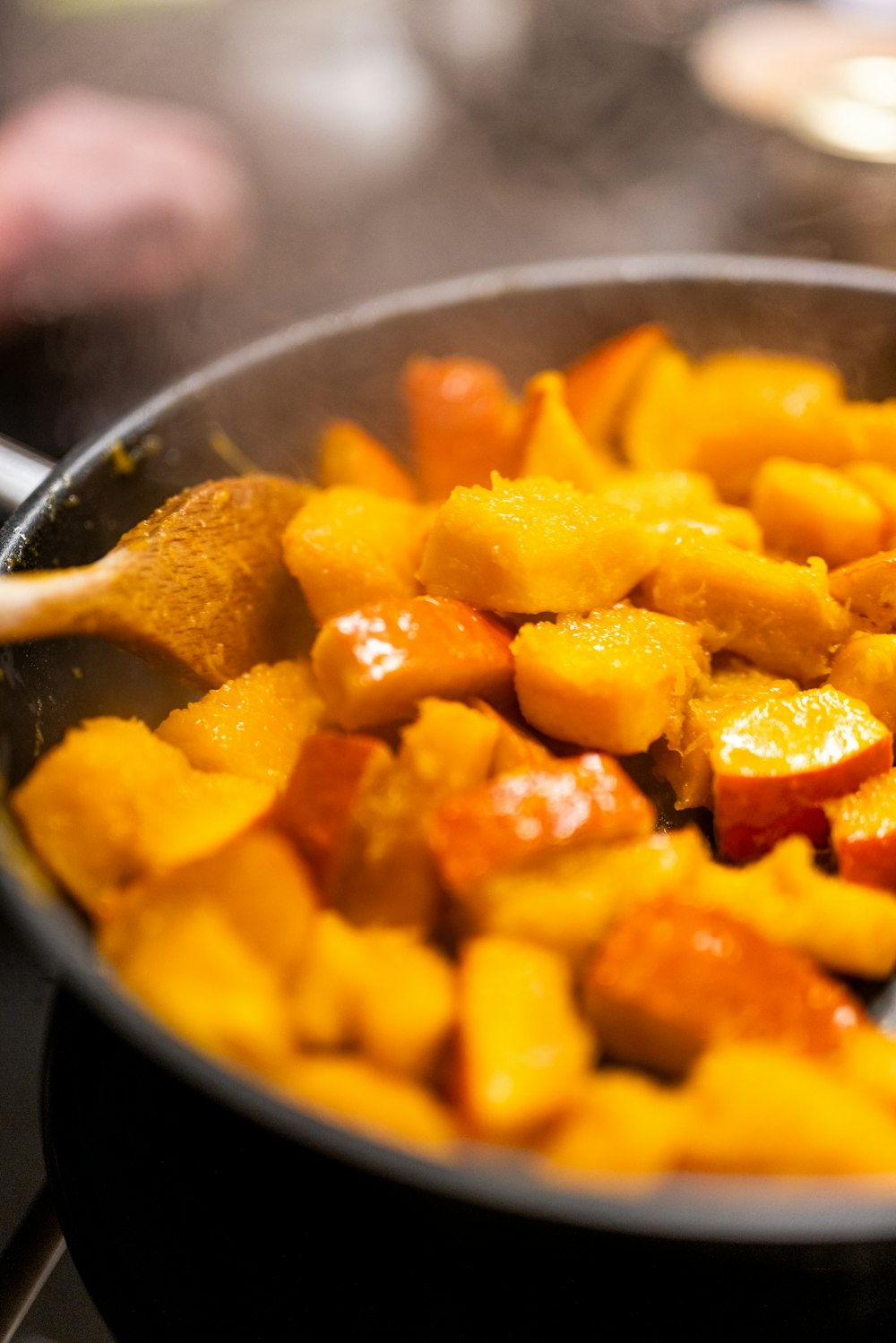 a pan filled with food sitting on top of a stove