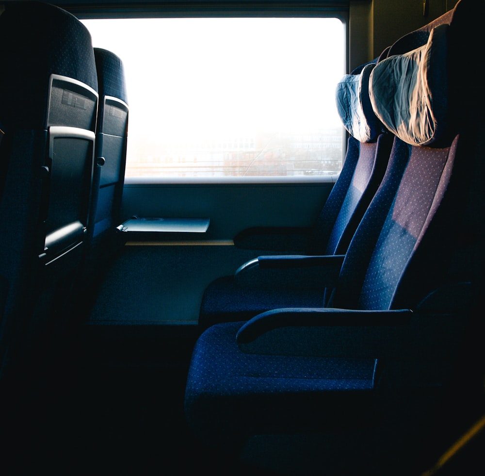 a row of seats sitting next to a window