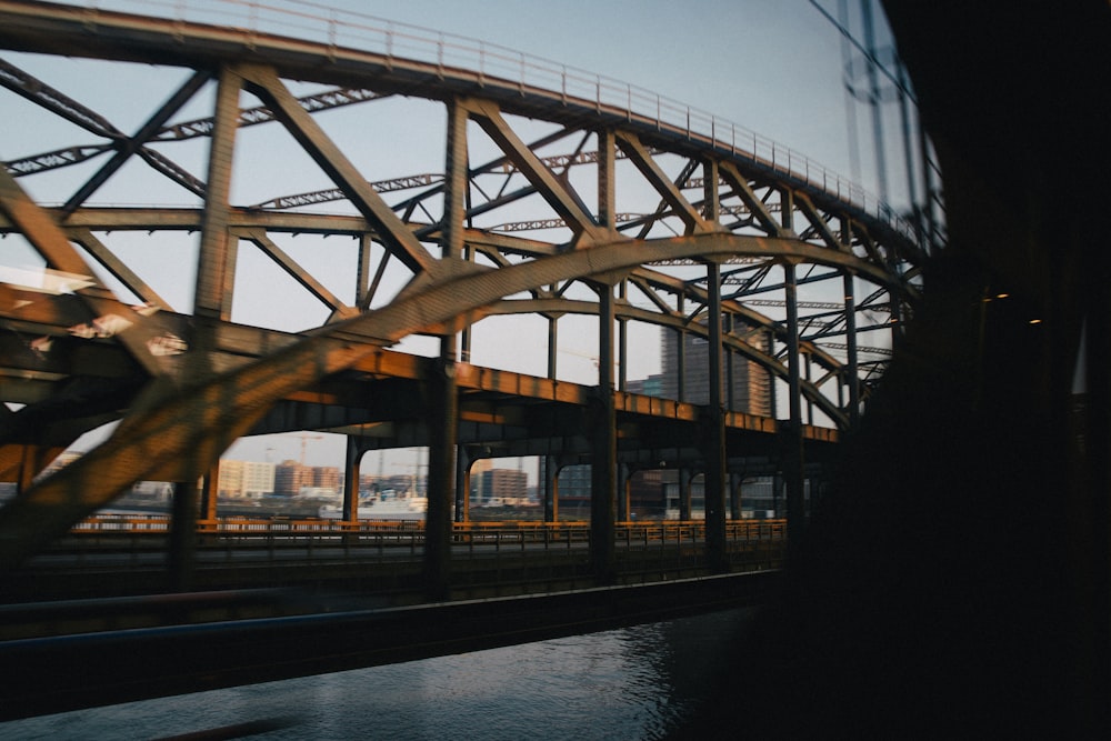 a train traveling over a bridge over a river