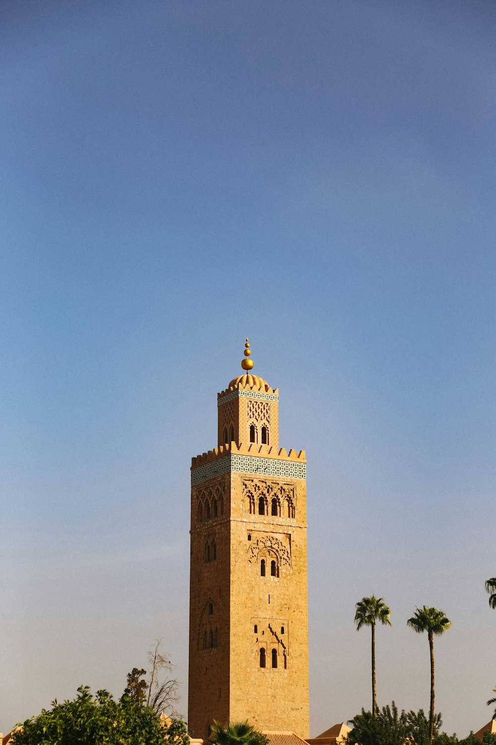 a tall tower with a clock on the top of it