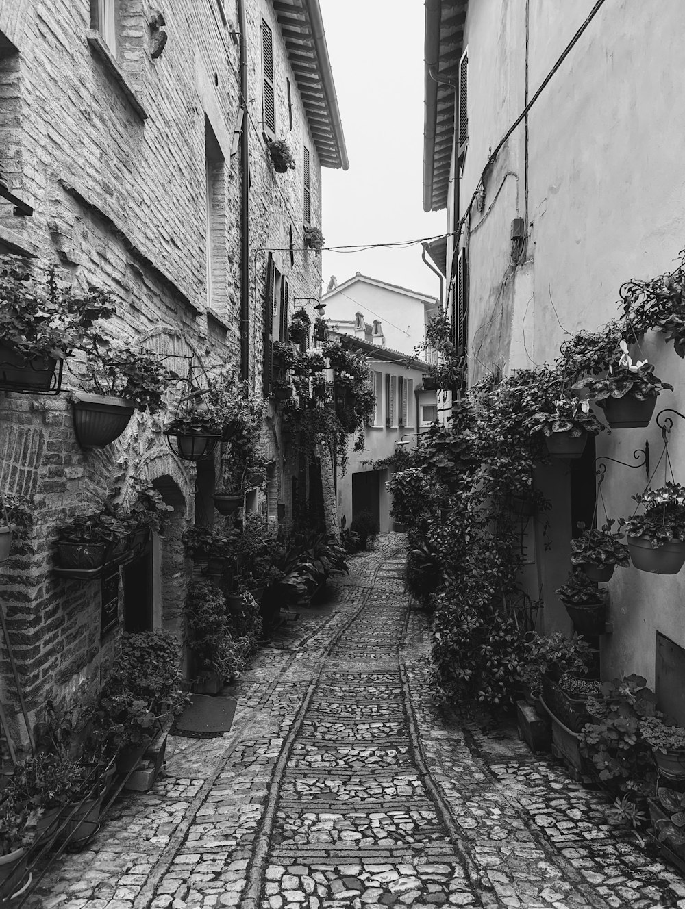 a narrow cobblestone street in an old town