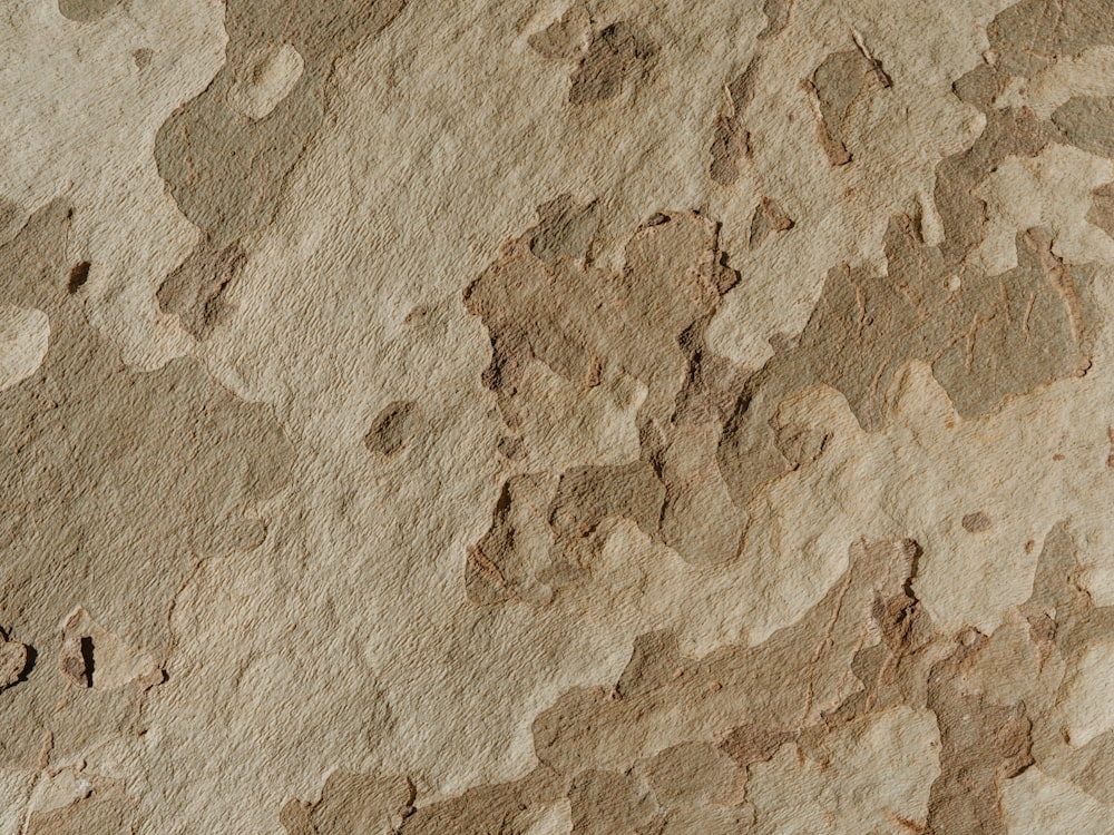 a close up of a wall with a pattern of rocks