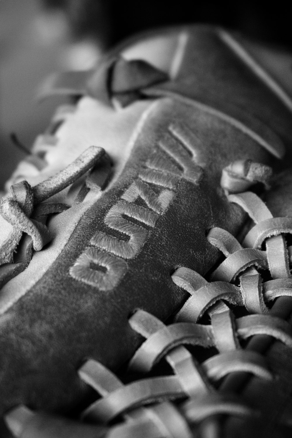 a black and white photo of a baseball glove