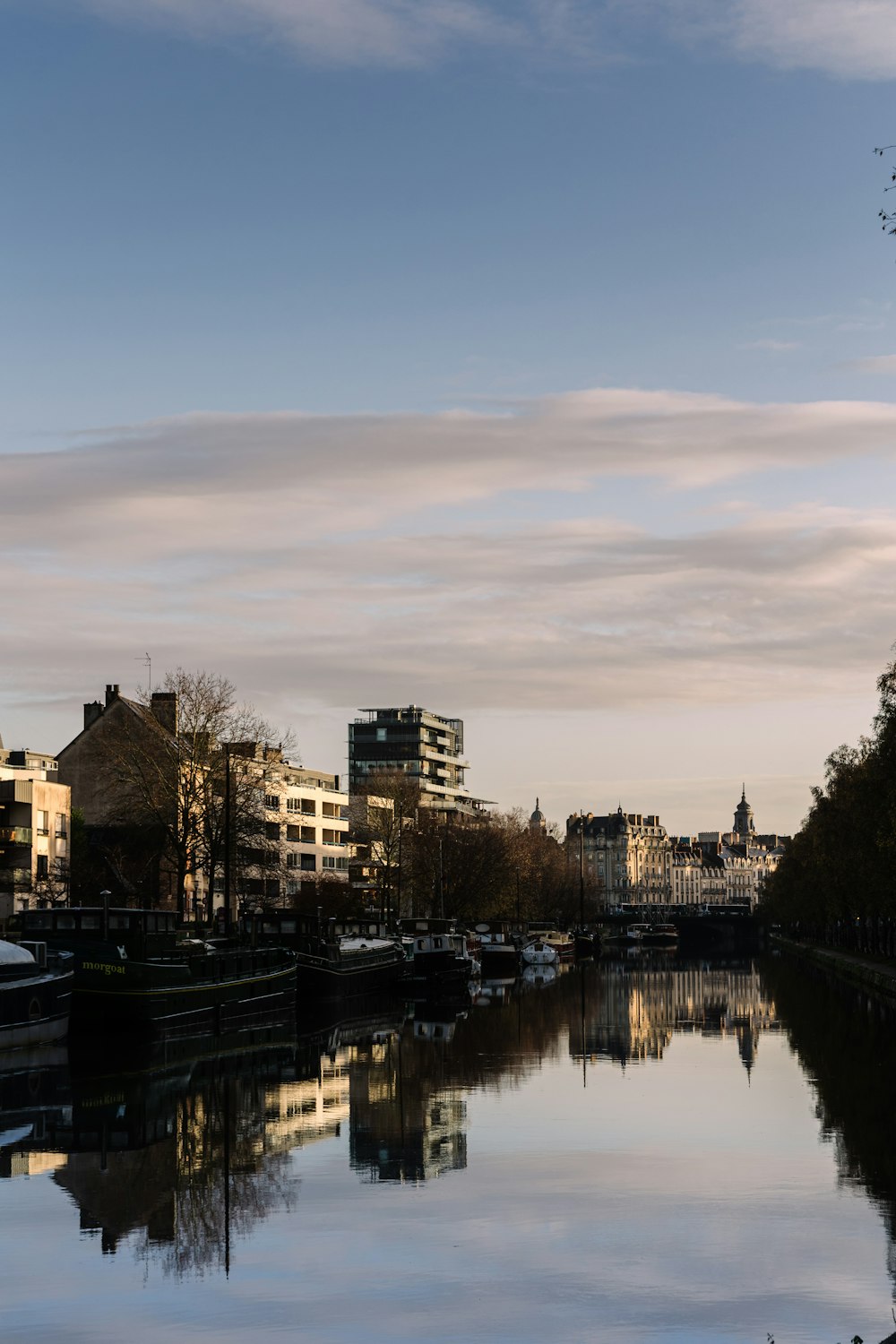 a river running through a city next to tall buildings