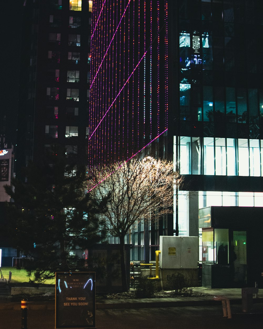 a tall building with a lot of lights on it