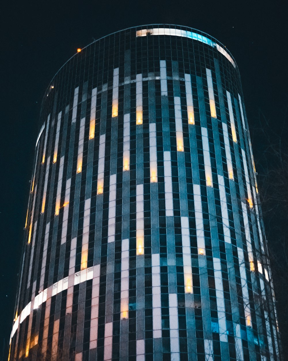 a very tall building lit up at night