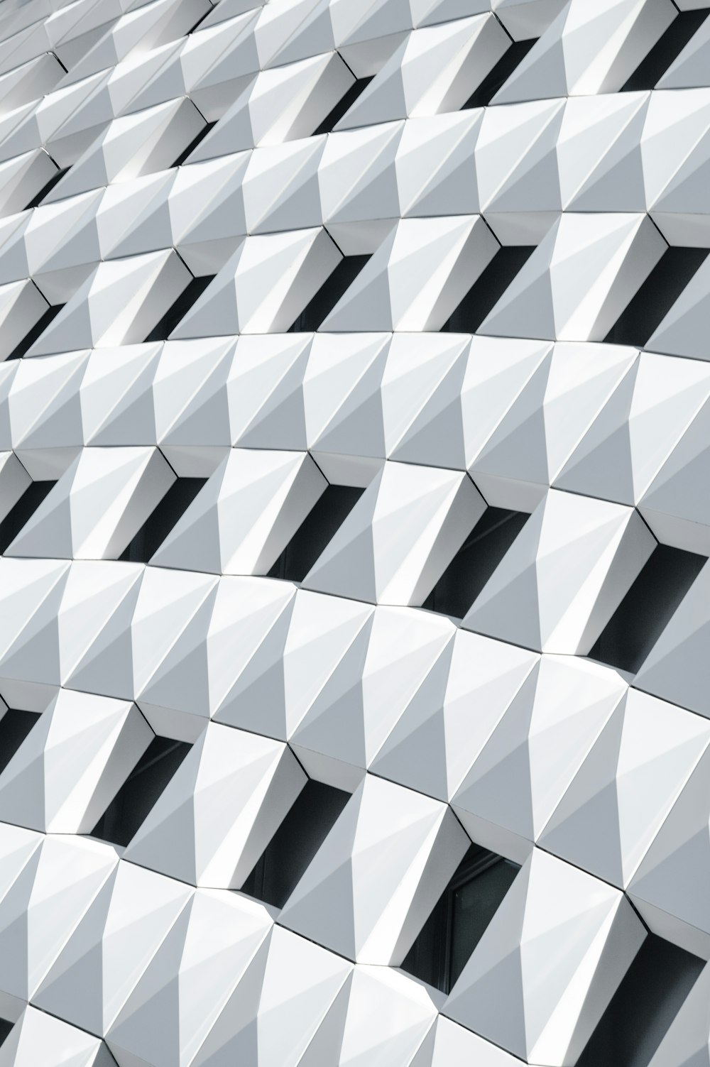 a close up of a building made of white tiles