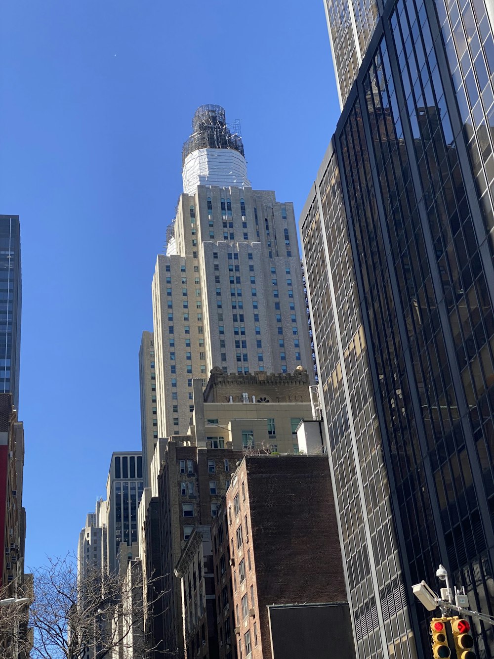 a city street with tall buildings and a traffic light