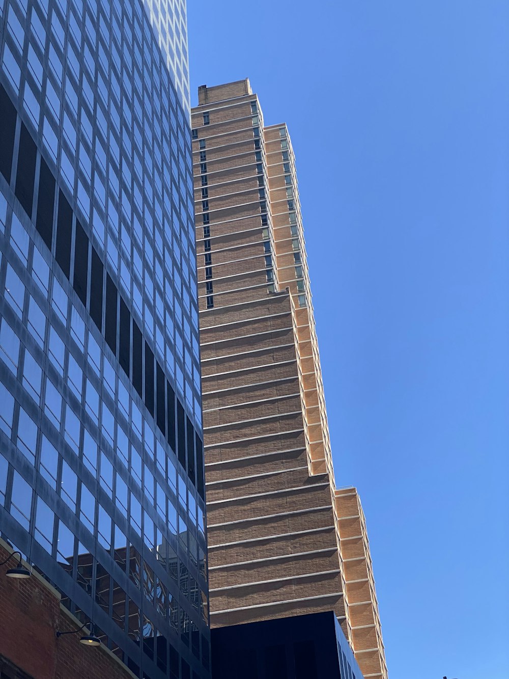 a very tall building next to a very tall building