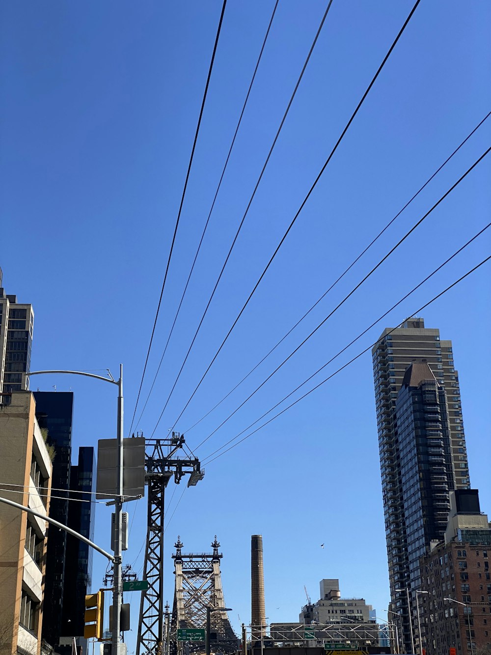 a city street filled with traffic next to tall buildings