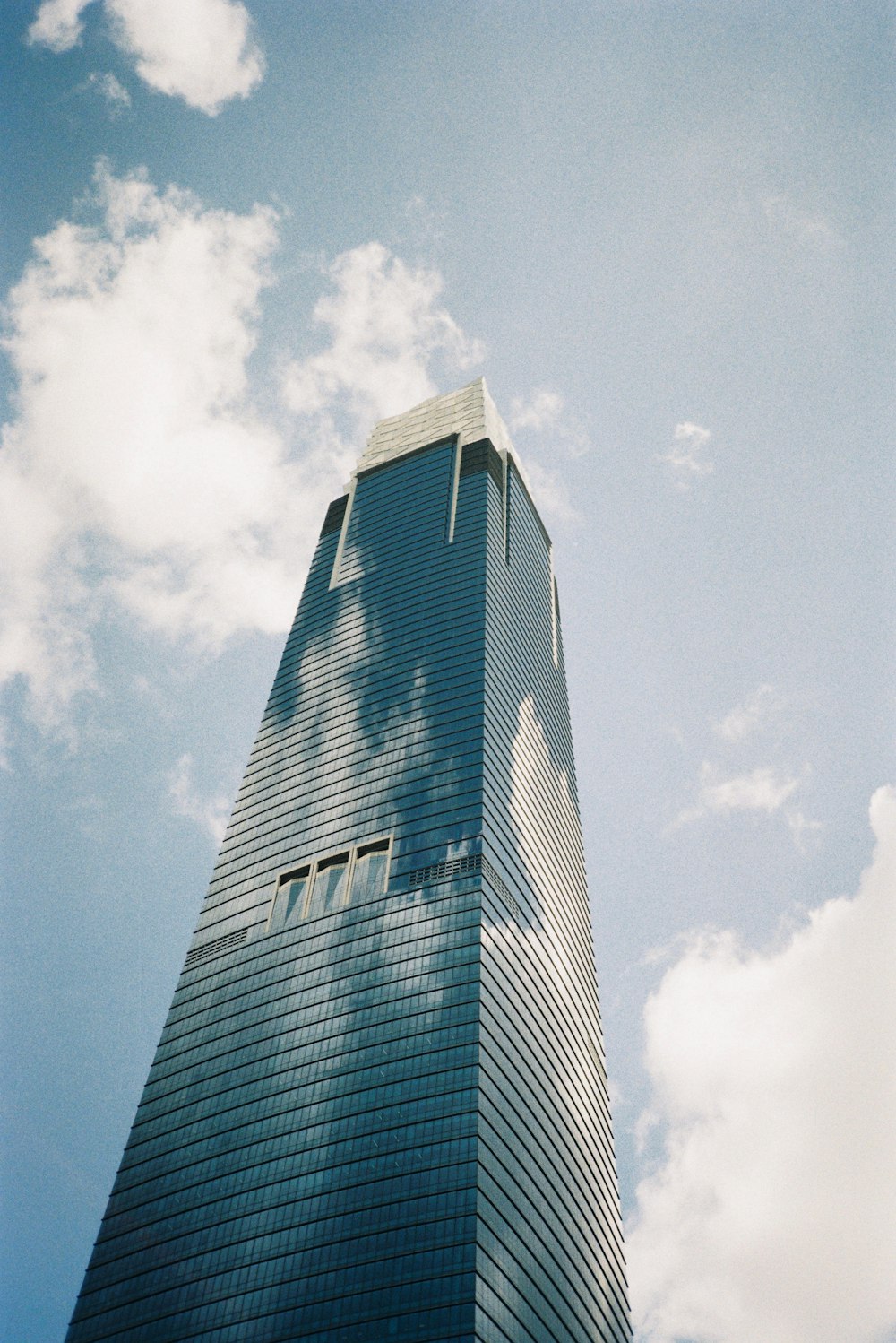 a very tall building with a sky background