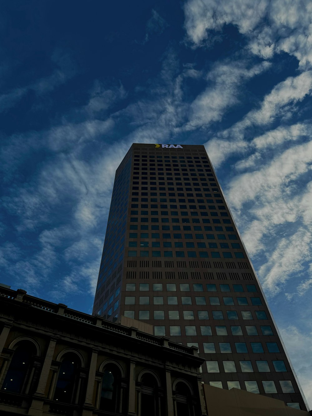 a very tall building with a sky background