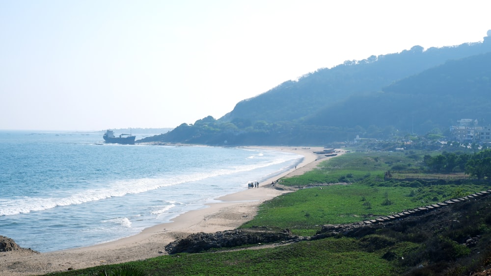 a view of a beach with a boat in the water