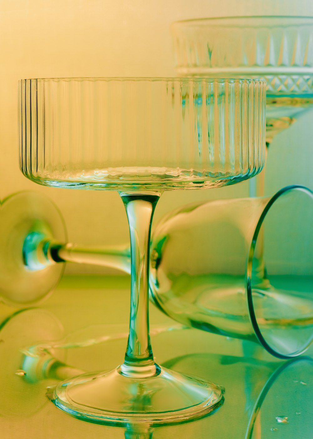 a couple of wine glasses sitting on top of a table