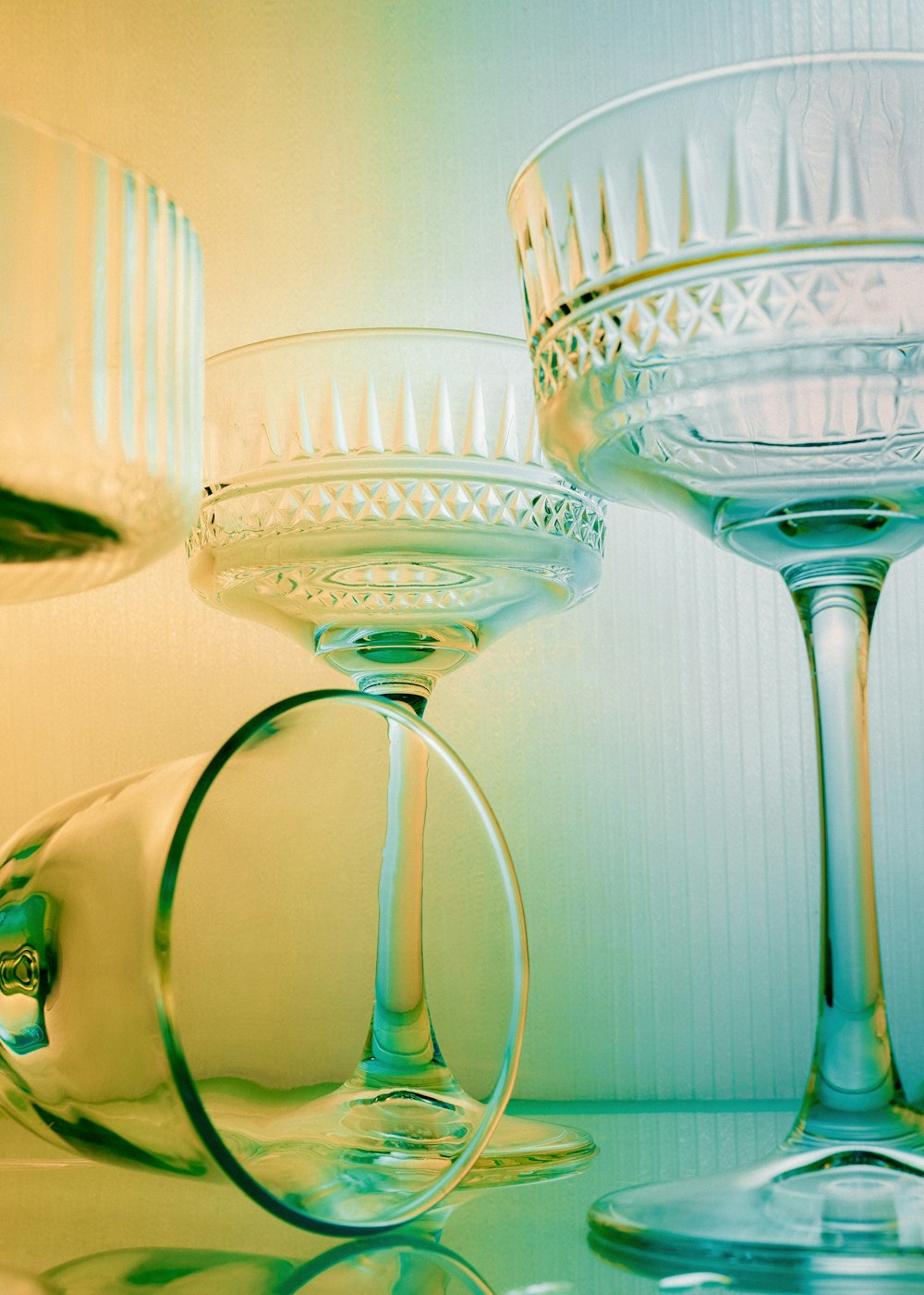 a couple of wine glasses sitting on top of a table