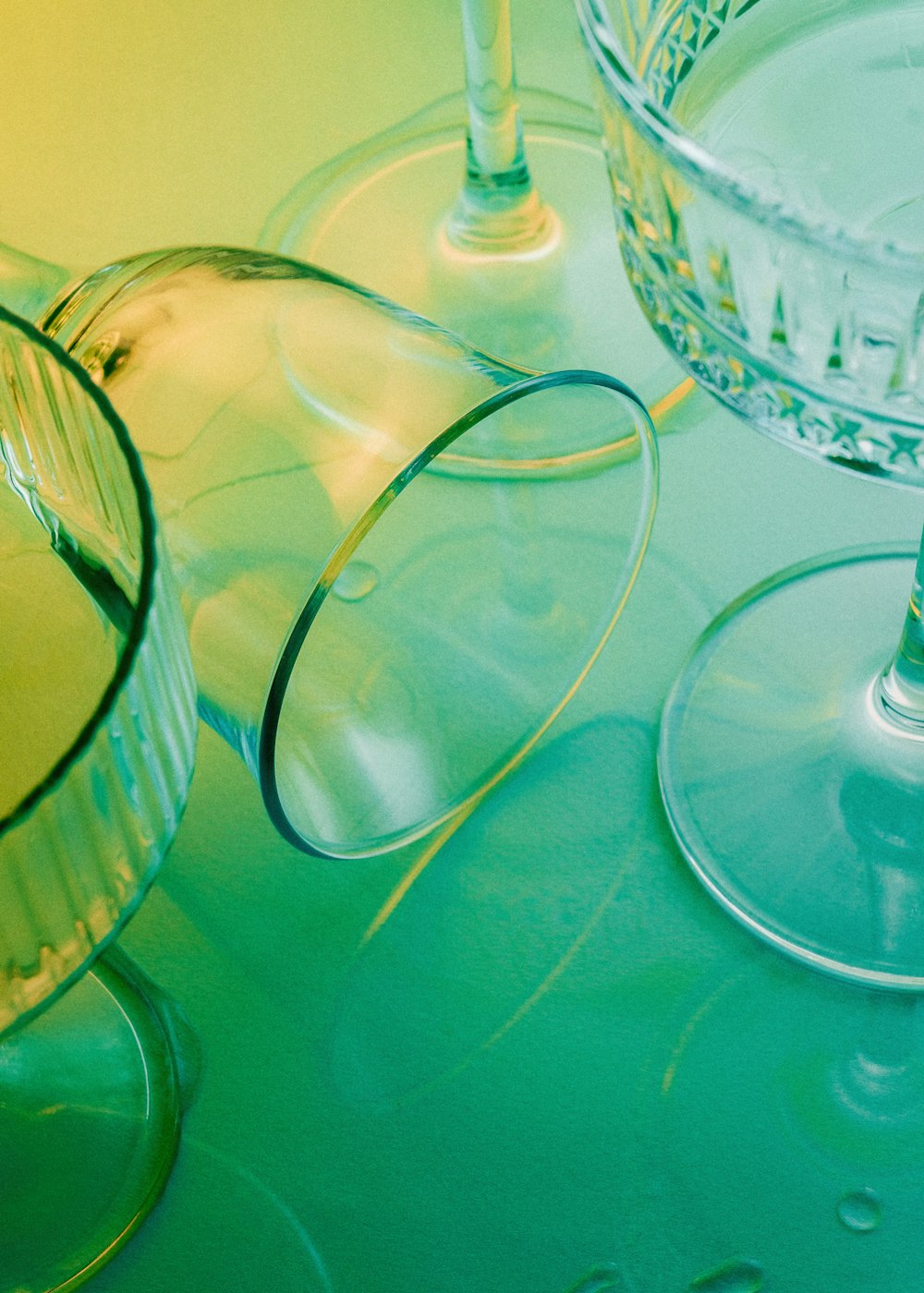 a close up of two wine glasses on a table