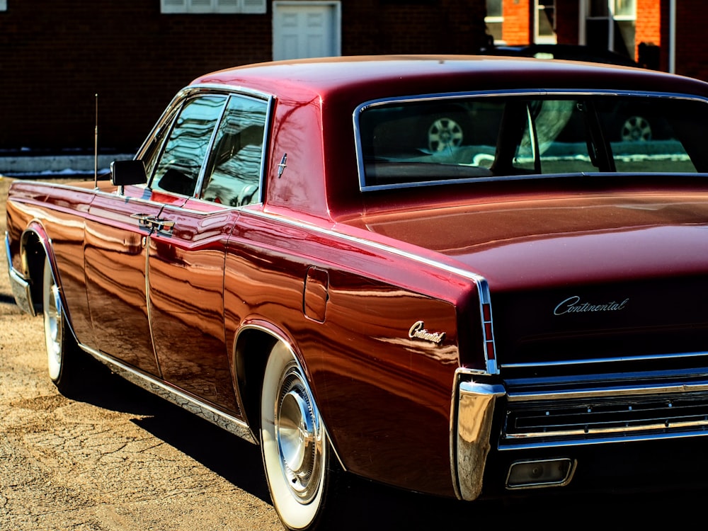 a red car parked on the side of the road