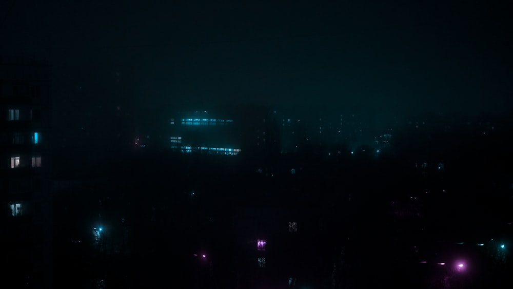 a dark city at night with street lights