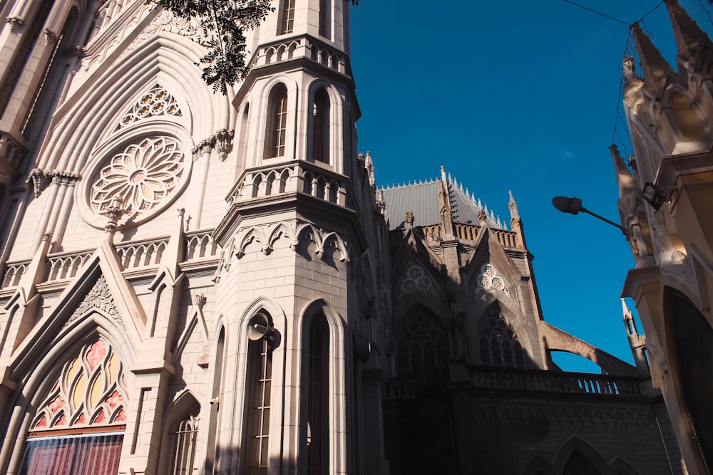 a large cathedral with a clock on it's side