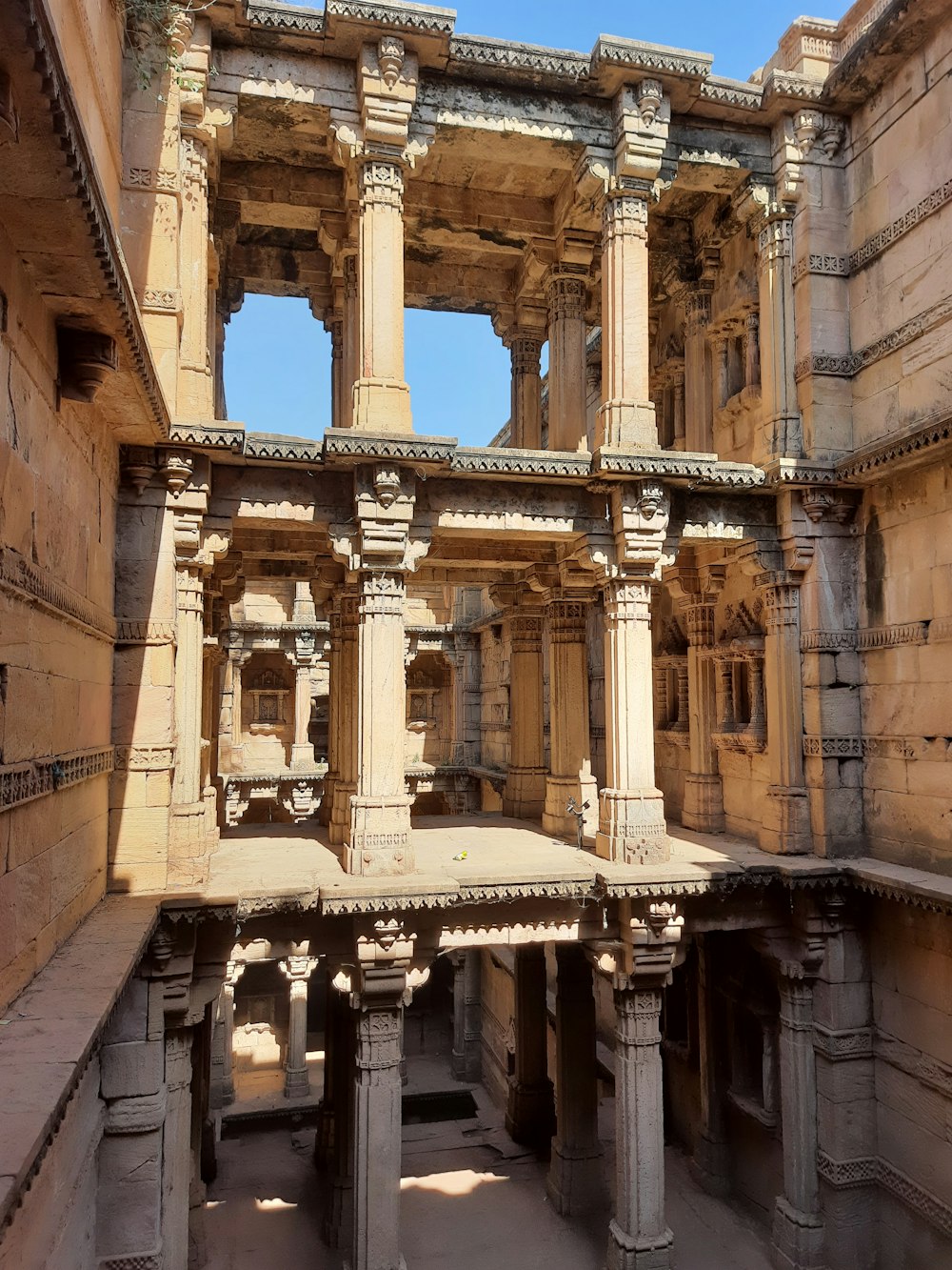 a large building with pillars and pillars in it