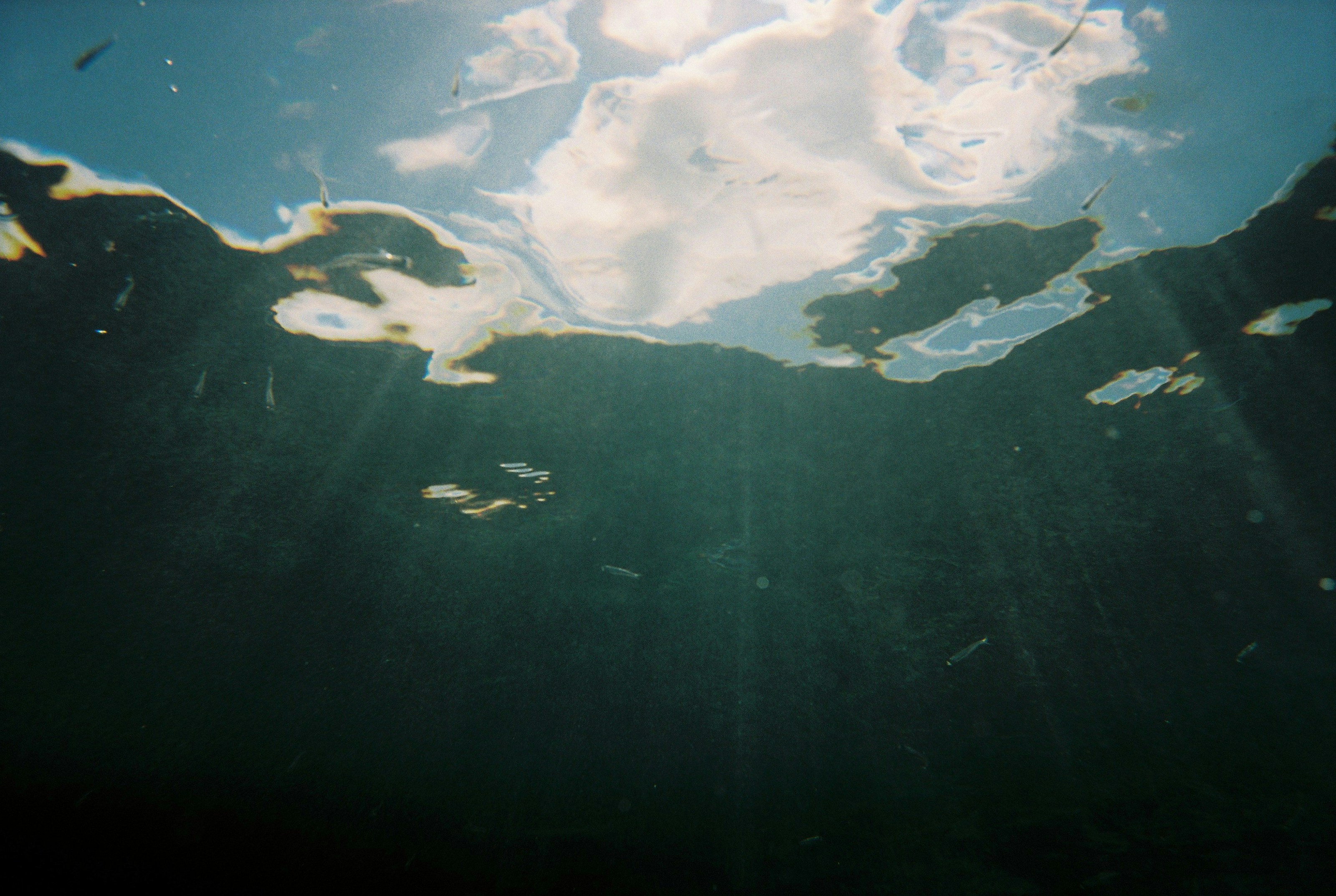 the sky is reflected in the water of the lake