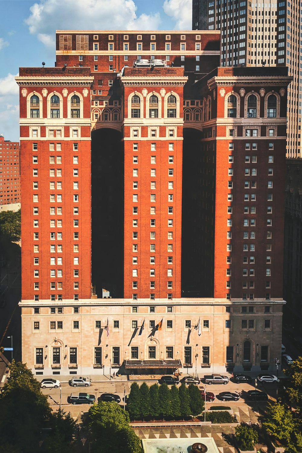 a large building with a fountain in front of it