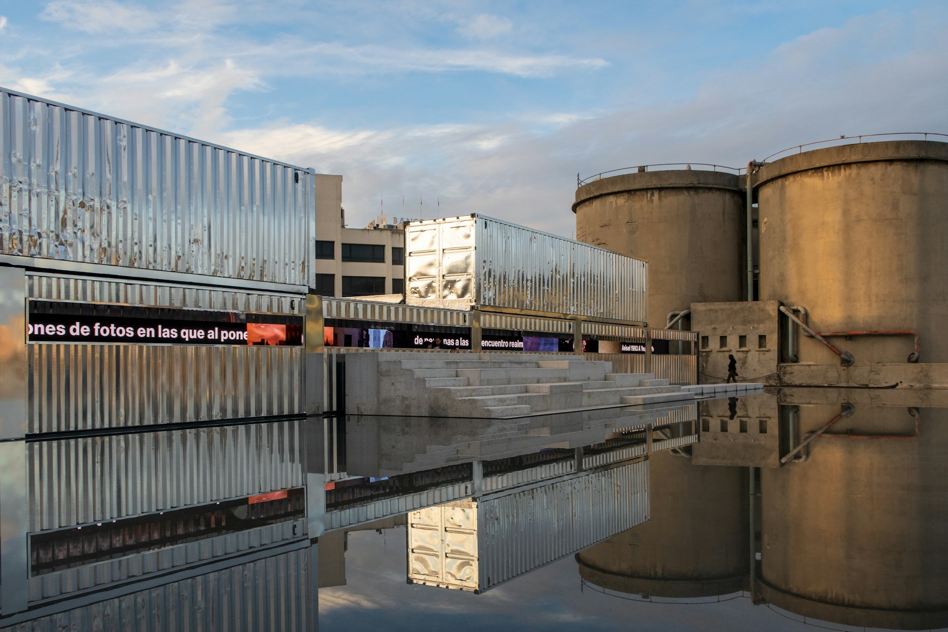 a reflection of a building in a body of water