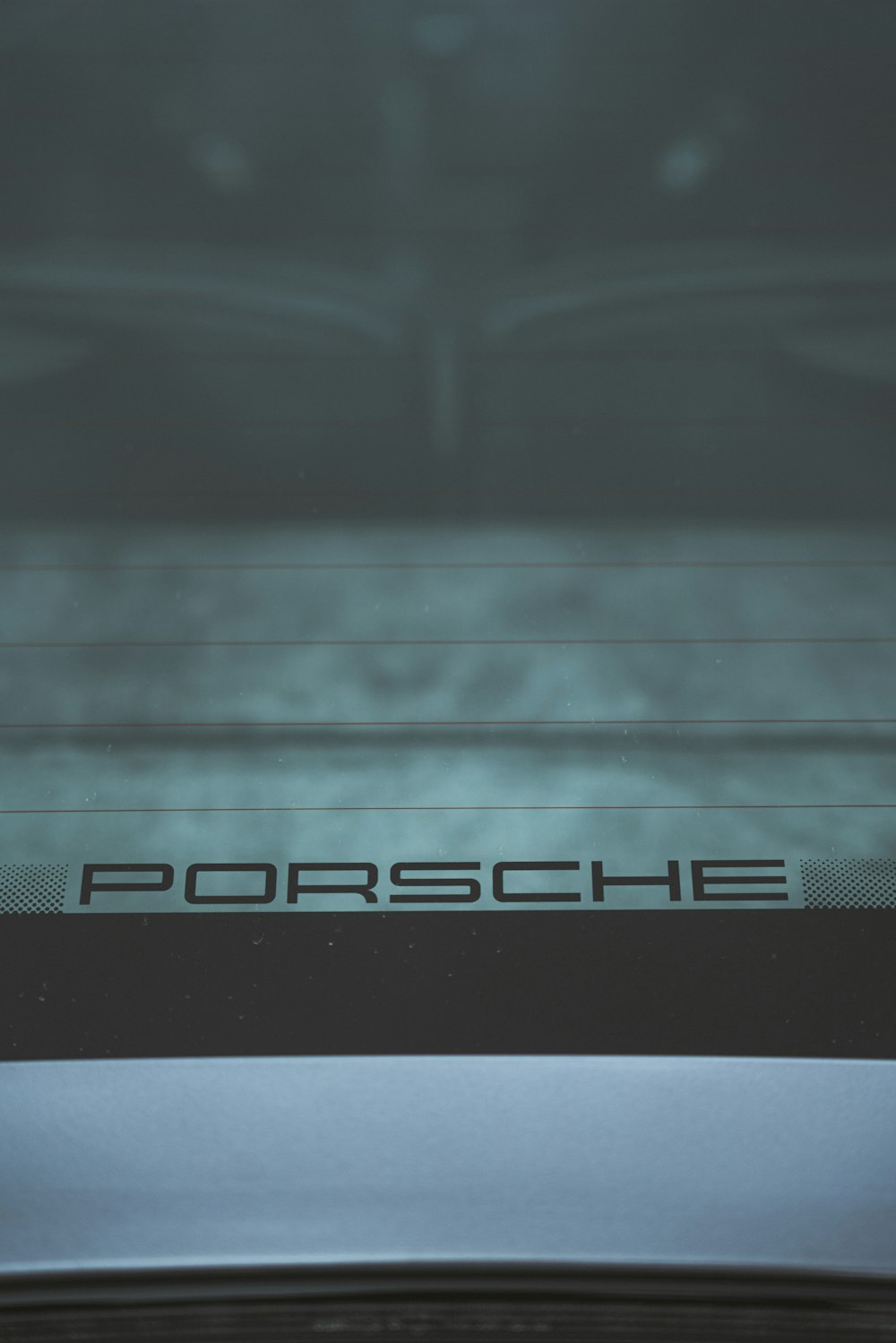 a close up of a porsche logo on a car