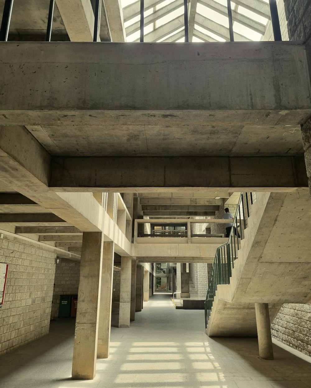 a very long hallway with a skylight above it